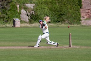 Man in white pants playing baseball